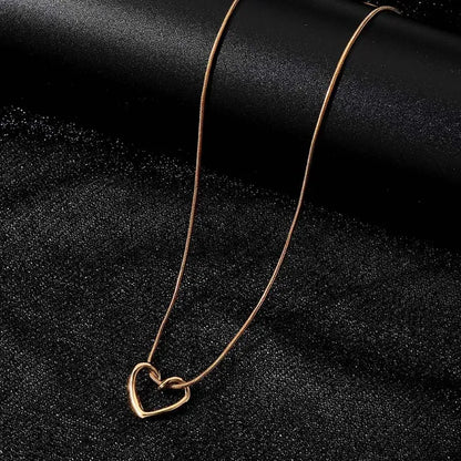 Twisted Heart Pendant Necklace – Gold Tone